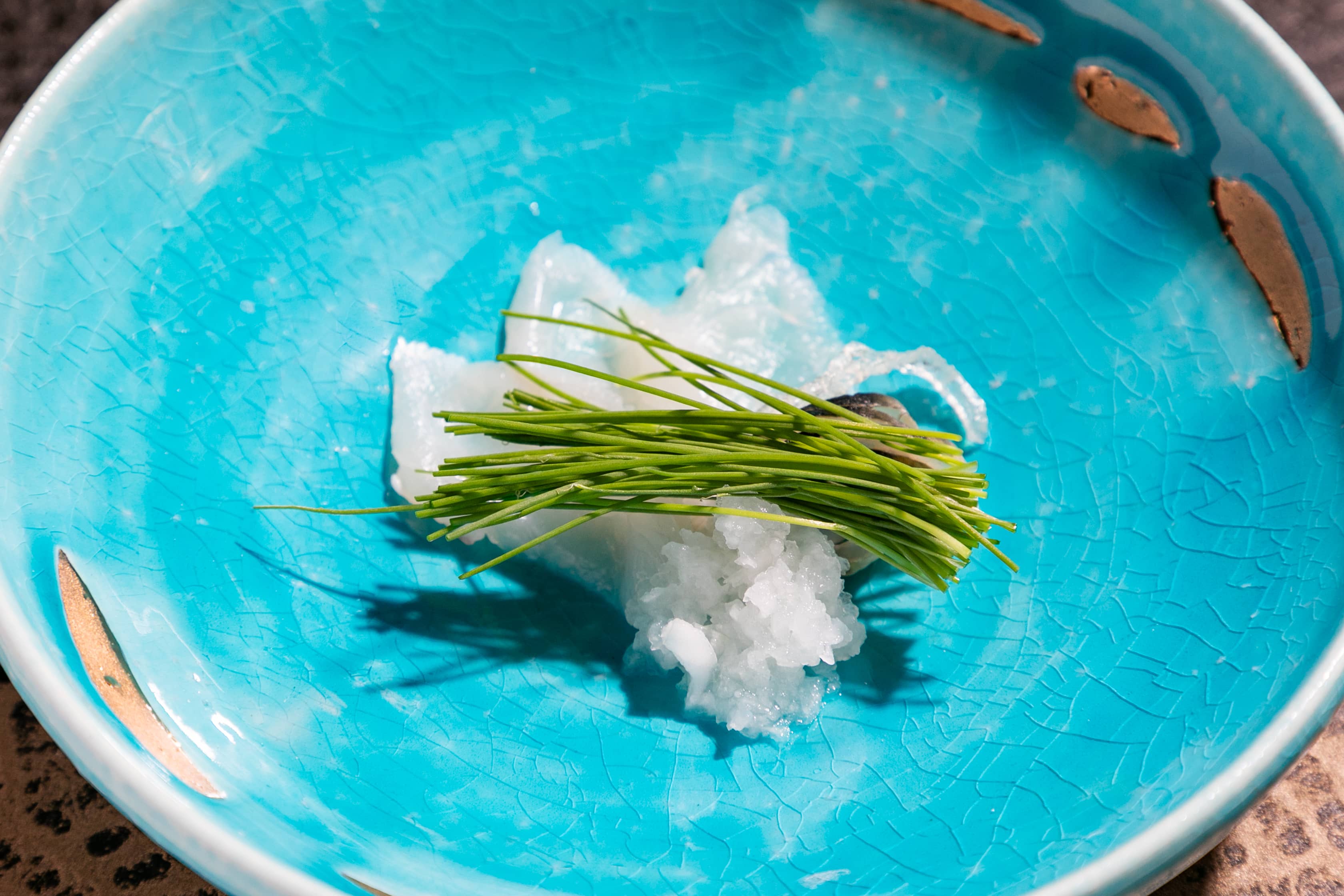 Pufferfish sashimi with few garnish (green onion bud, daikon chilil, kabosu citrus)